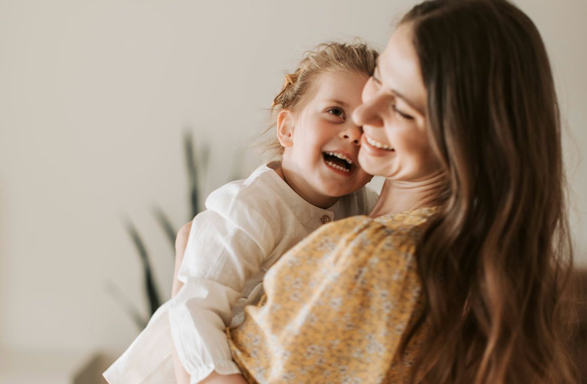 Single parent and child discussing life insurance protection